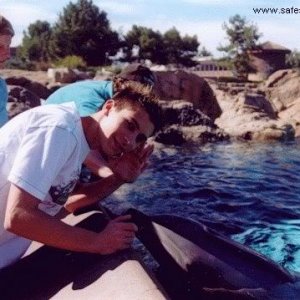 Justin Berfield snapped with some dolphins