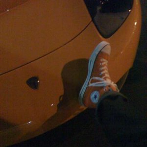 Chris Masterson's Orange Shoe On Orange Tesla