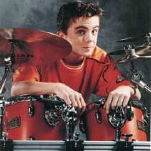 Frankie posing with his drum kit