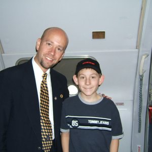Erik Per Sullivan with flight attendant 'Sluggo' (2004)