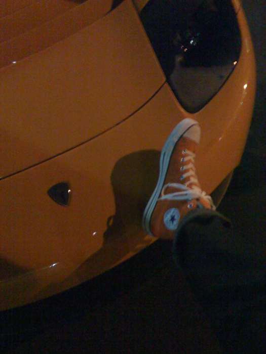 Chris Masterson's Orange Shoe On Orange Tesla