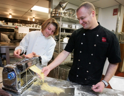Erik Per Sullivan making pasta with chef Dante de Magistris