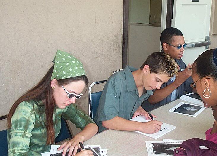 Justin Berfield signing pictures at some event in 2003
