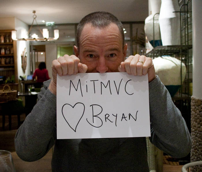 Bryan Cranston hold a MITMVC (heart) Bryan sign